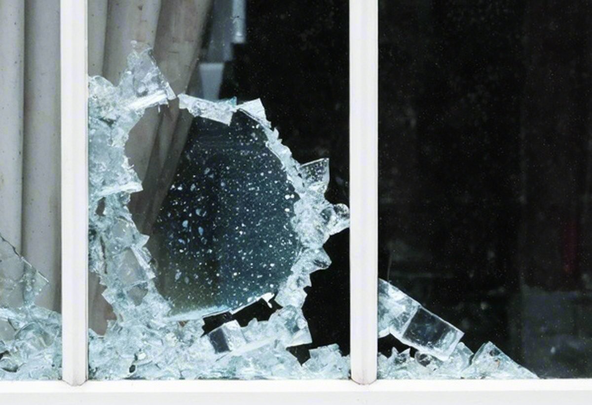 Close-up of the broken pane in the timber frame
