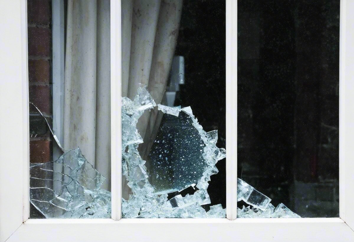 Before: close-up of the smashed pane in the timber frame